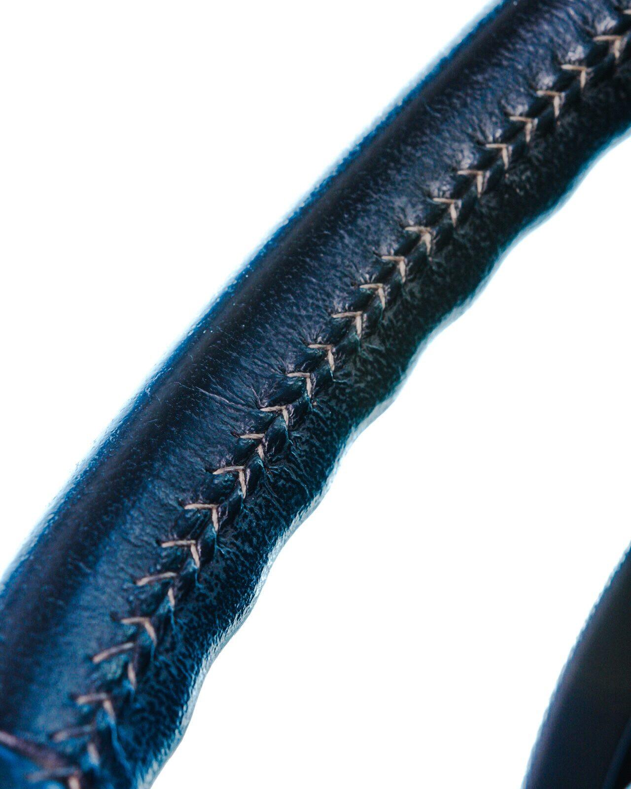 Close-up of the stitching on a leather steering wheel